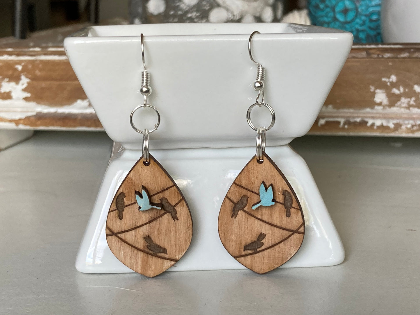 Hand painted blue bird on wire earrings