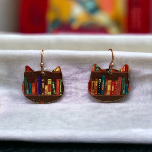 Cat earrings featuring colorful books